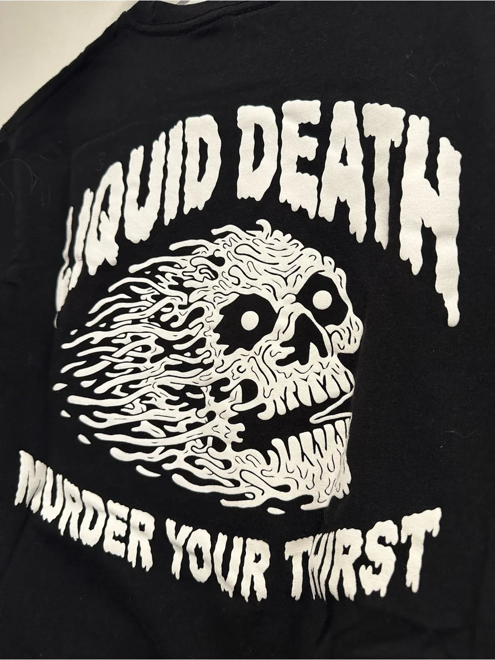 Liquid Death Sz:M Instant Death black/ white Melting Flaming Skull graphic Tee.